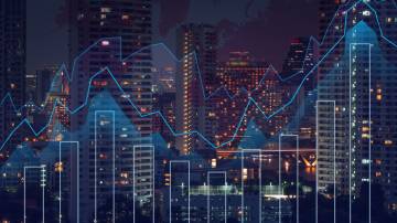 Trading graph on the cityscape at night and world map background,Business financial concept