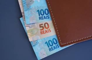 Brazilian money on a wallet. Brazilian economy concept.