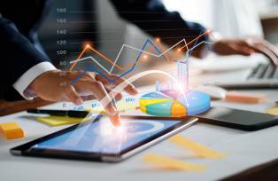 Businessman using tablet and laptop analyzing sales data and economic growth graph chart. Business strategy. Digital marketing. Business innovation technology concept