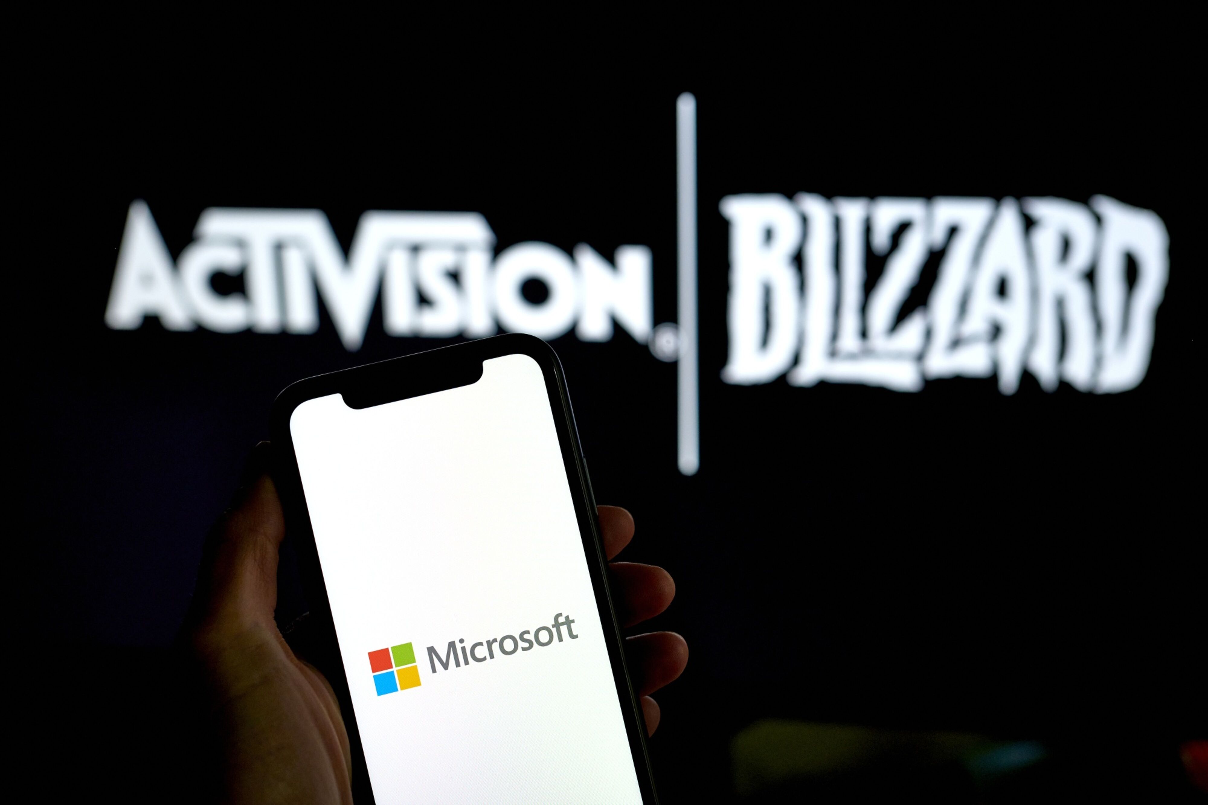 The Microsoft logo on a smartphone arranged in the Brooklyn borough of New York, US, on Monday, May 16, 2023. Microsoft Corp.'s $69 billion takeover of Activision Blizzard Inc. won European Union approval, putting the bloc at odds with its UK and US counterparts. Photographer: Gabby Jones/Bloomberg