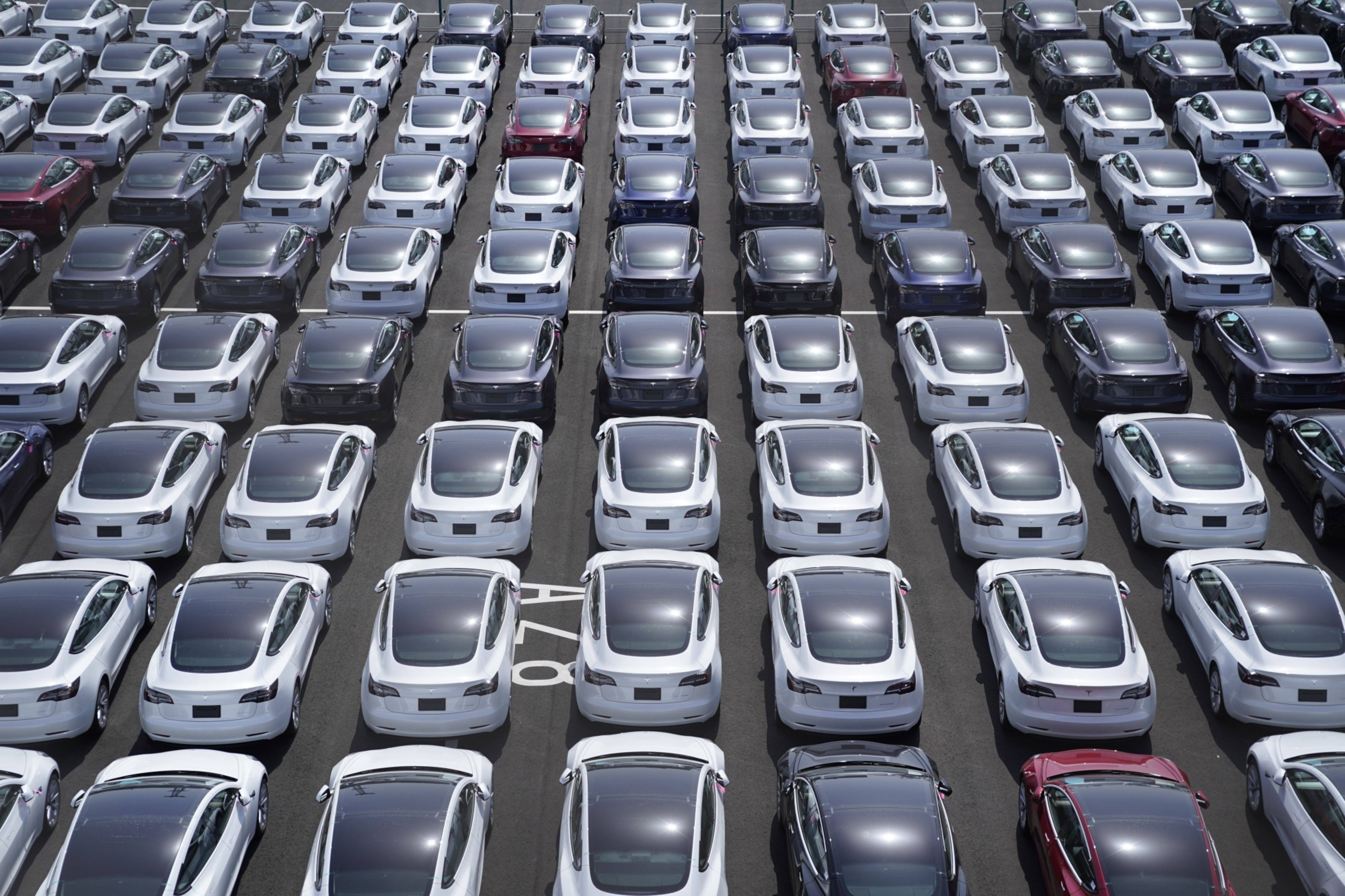 Tesla vehicles in a parking lot after arriving at a port in Yokohama, Japan. Photographer:  Toru Hanai/Bloomberg